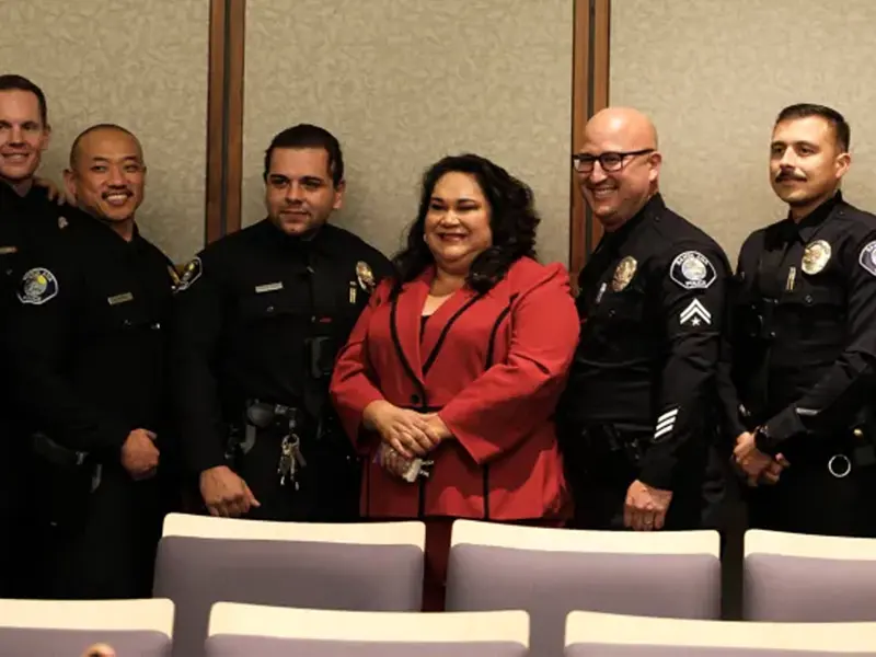 Santa Ana Mayor Valerie Amezcua posing for photos with Santa Ana Police Union leadership.