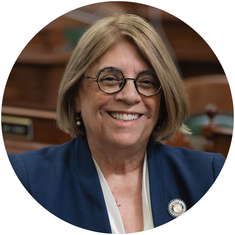 A portrait of smiling Cecilia Aguiar-Curry