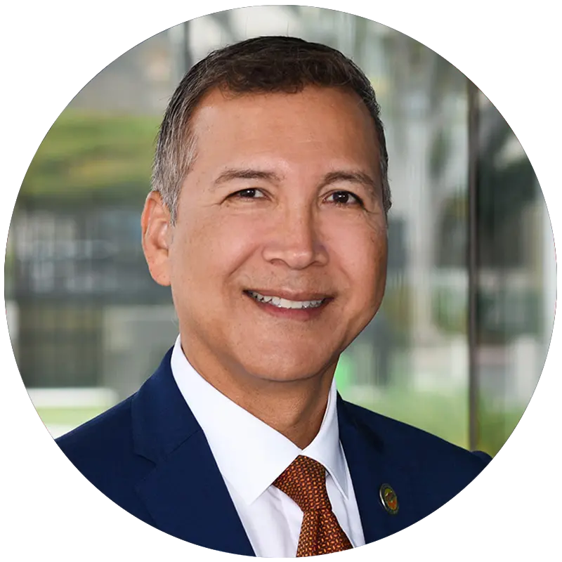 Orange County Supervisor Vicente Sarmiento, in a suit, smiling
