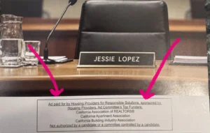 A mailer showing an empty chair, microphone, Jessie Lopez name plaque, and political disclaimer.